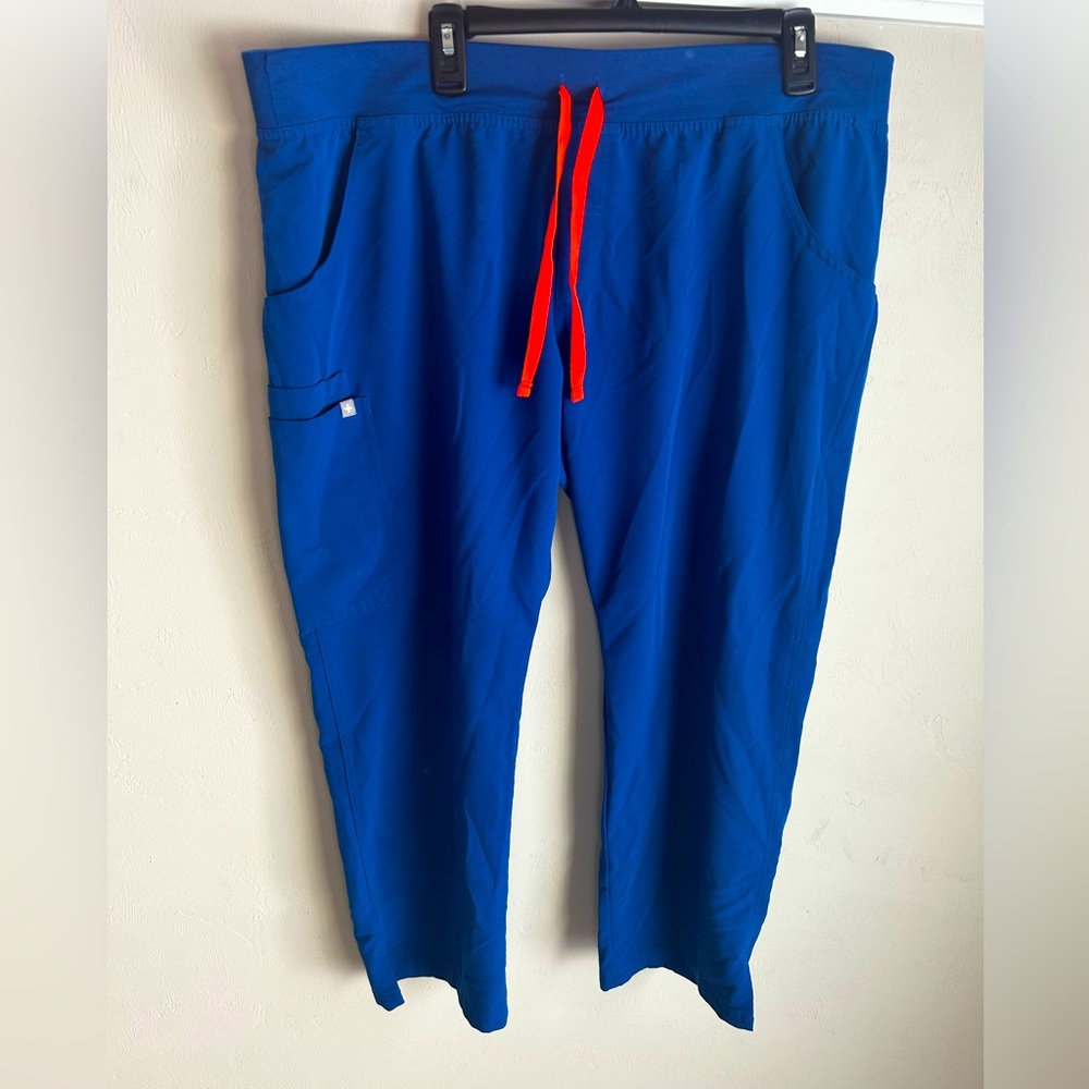 FIGS Women’s Winning Blue Kade Cargo Scrub Pants with orange string